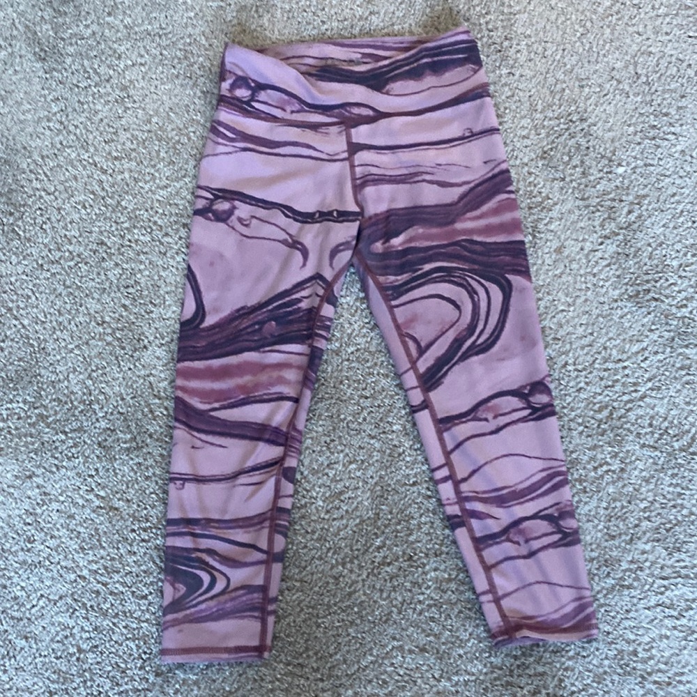 Pink yoga pants with marble design on them. Size large.